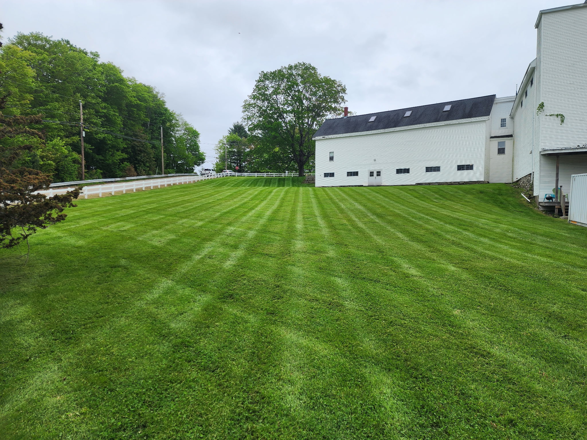Landscaping team working in Strafford County, NH residential yard