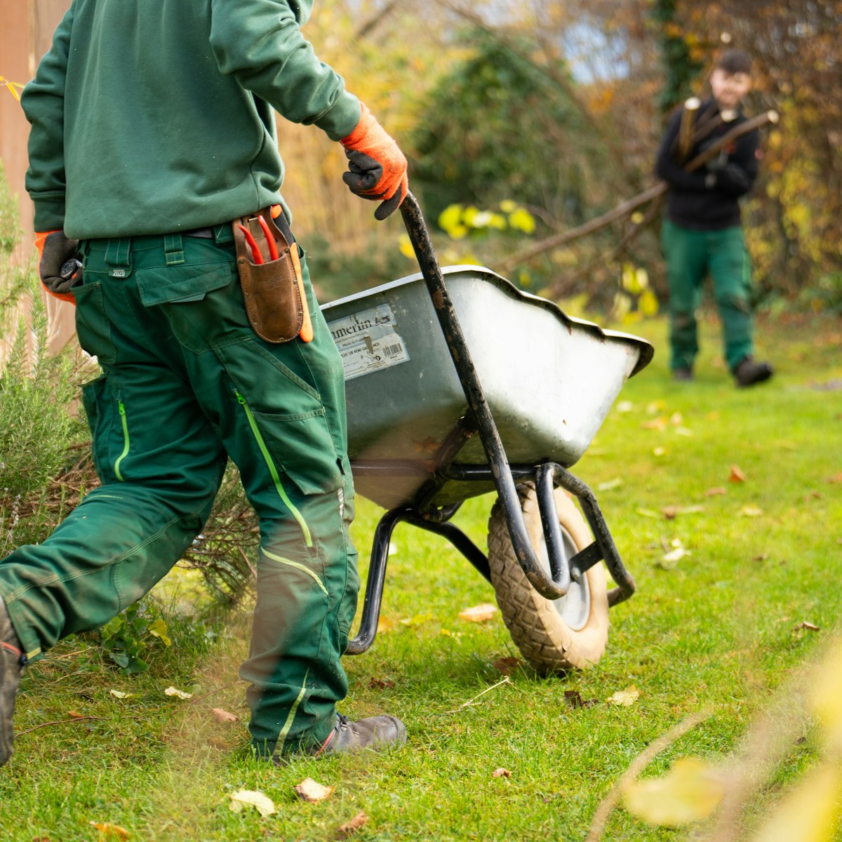 Professional landscaping crew performing seasonal lawn and property maintenance, representing Expert Lawn Care in Rochester, NH.