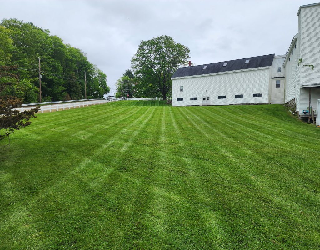 Landscaping team working in Strafford County, NH residential yard