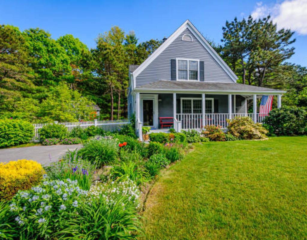 Freshly landscaped front yard with shrubs flowers and clean edging lines